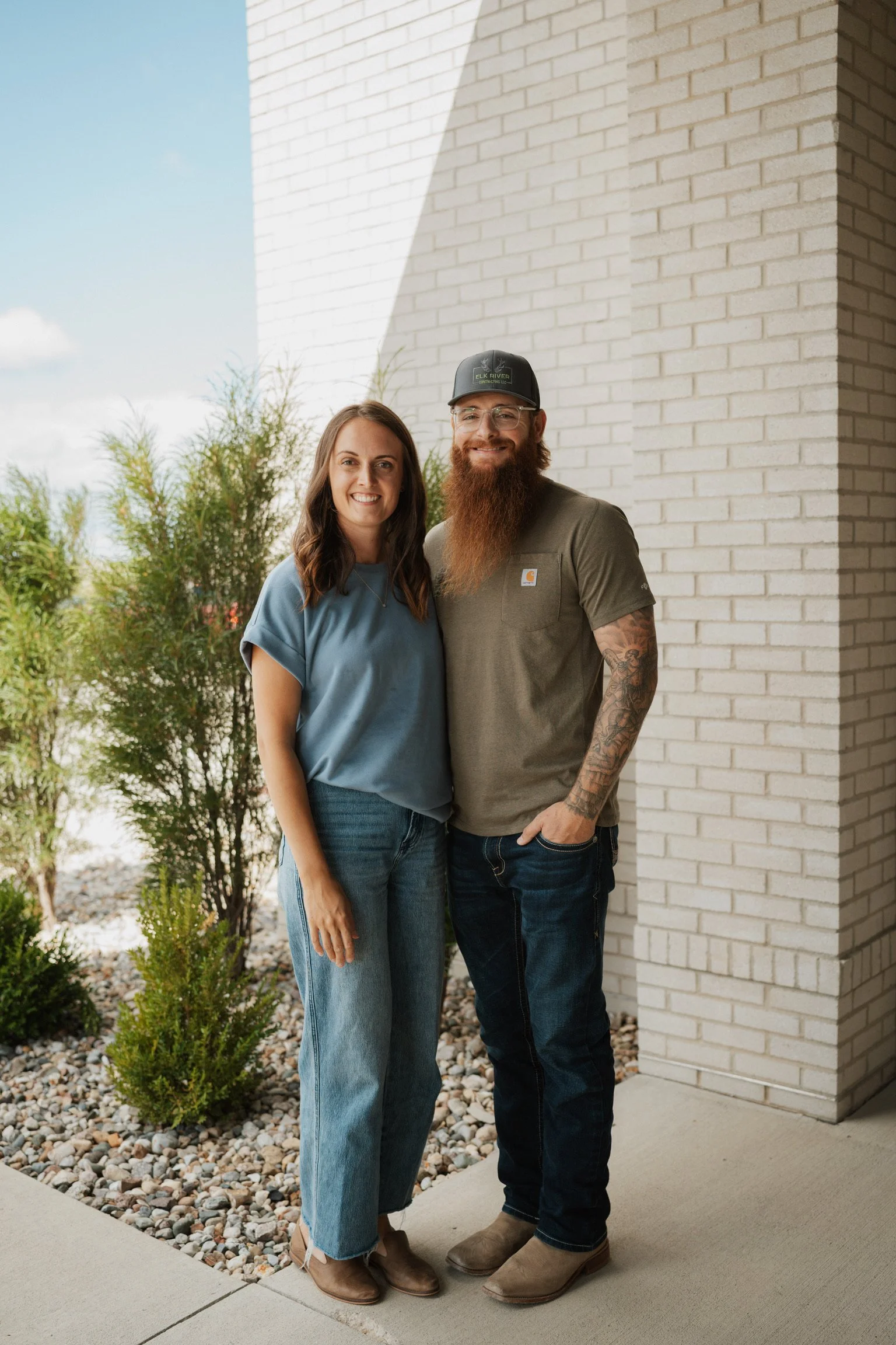 Marquel Stuedemann, a Christian author and speaker, with her husband standing and posing for a photo.