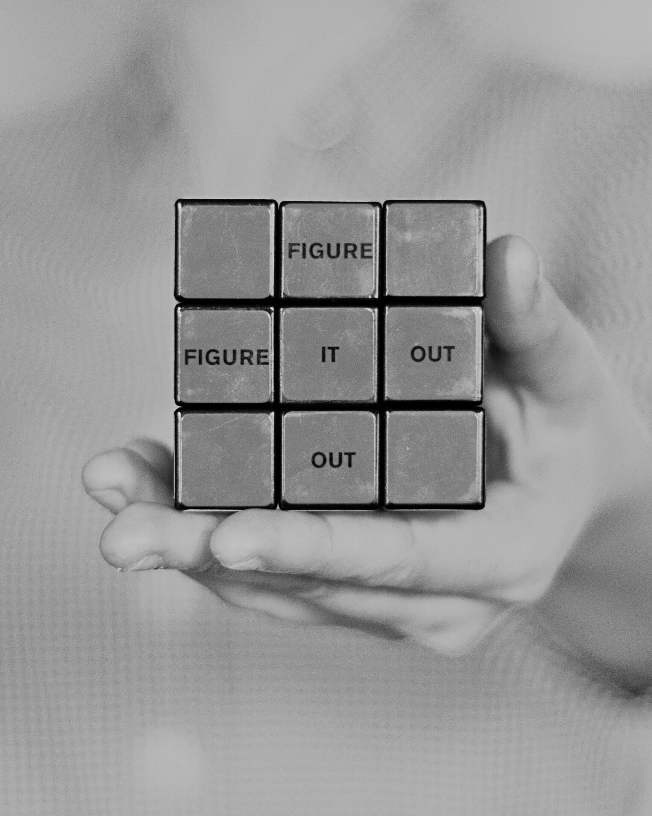 Rubik's cube with 'figure it out' written on it — solving complex OHS compliance challenges