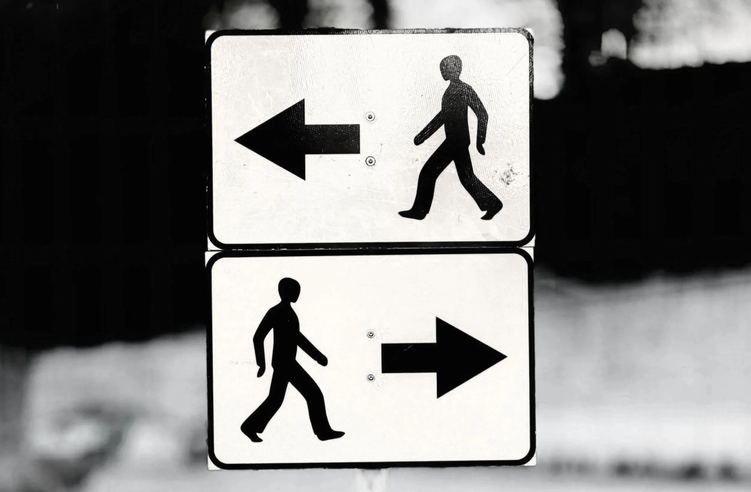 Direction sign pointing left and right — navigating safety consulting and compliance options