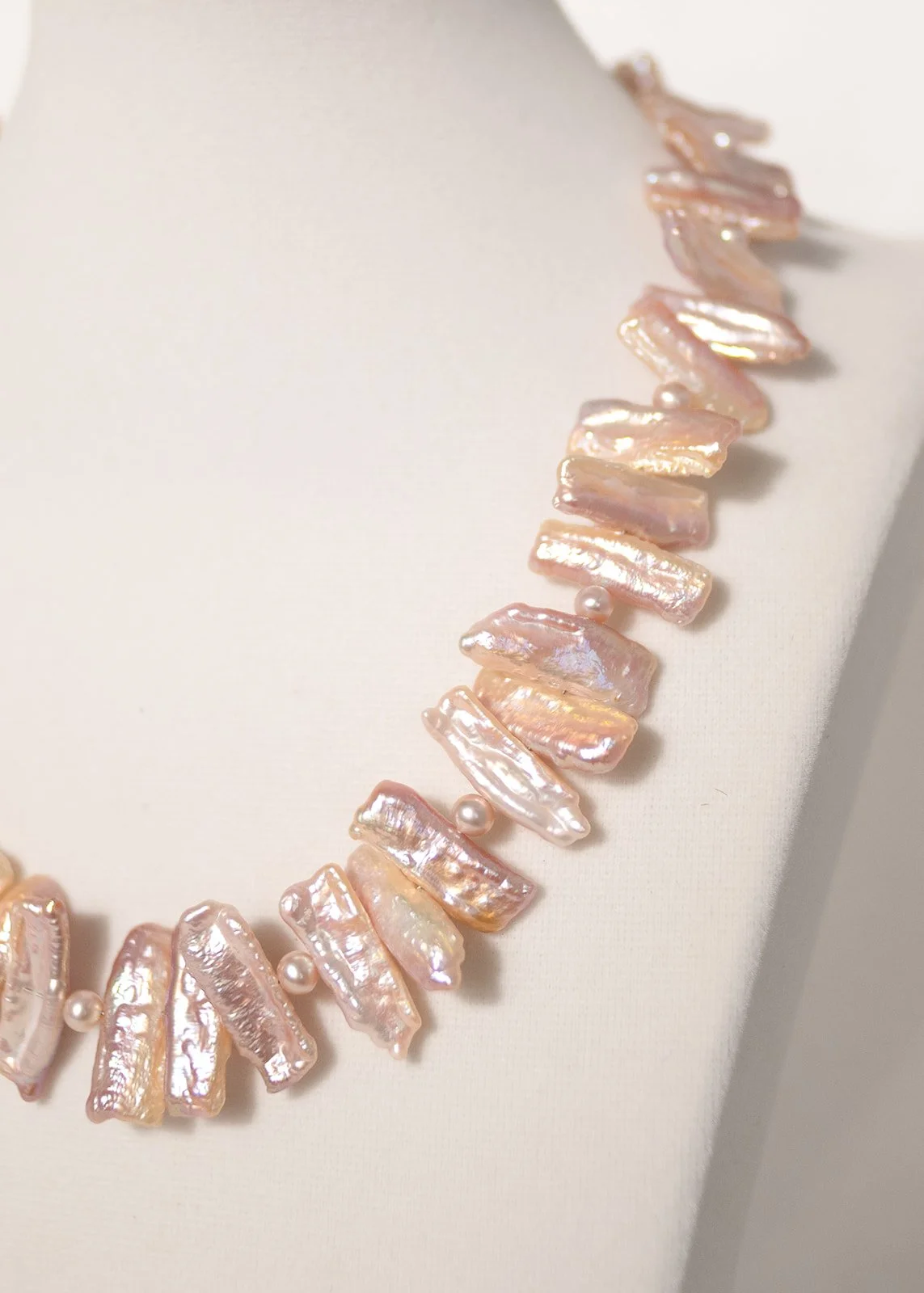Pink baroque pearl necklace with elegant gemstone accents, a luxury statement piece inspired by Hawaiian beauty and perfect for special occasions.
