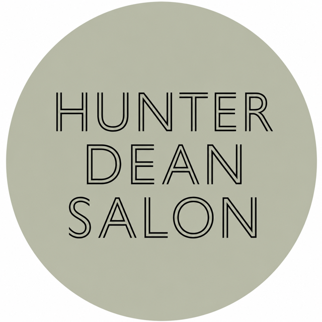 Logo of Hunter Dean Salon with black text on a light green background.