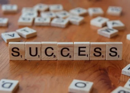 tiles spelling out the word success
