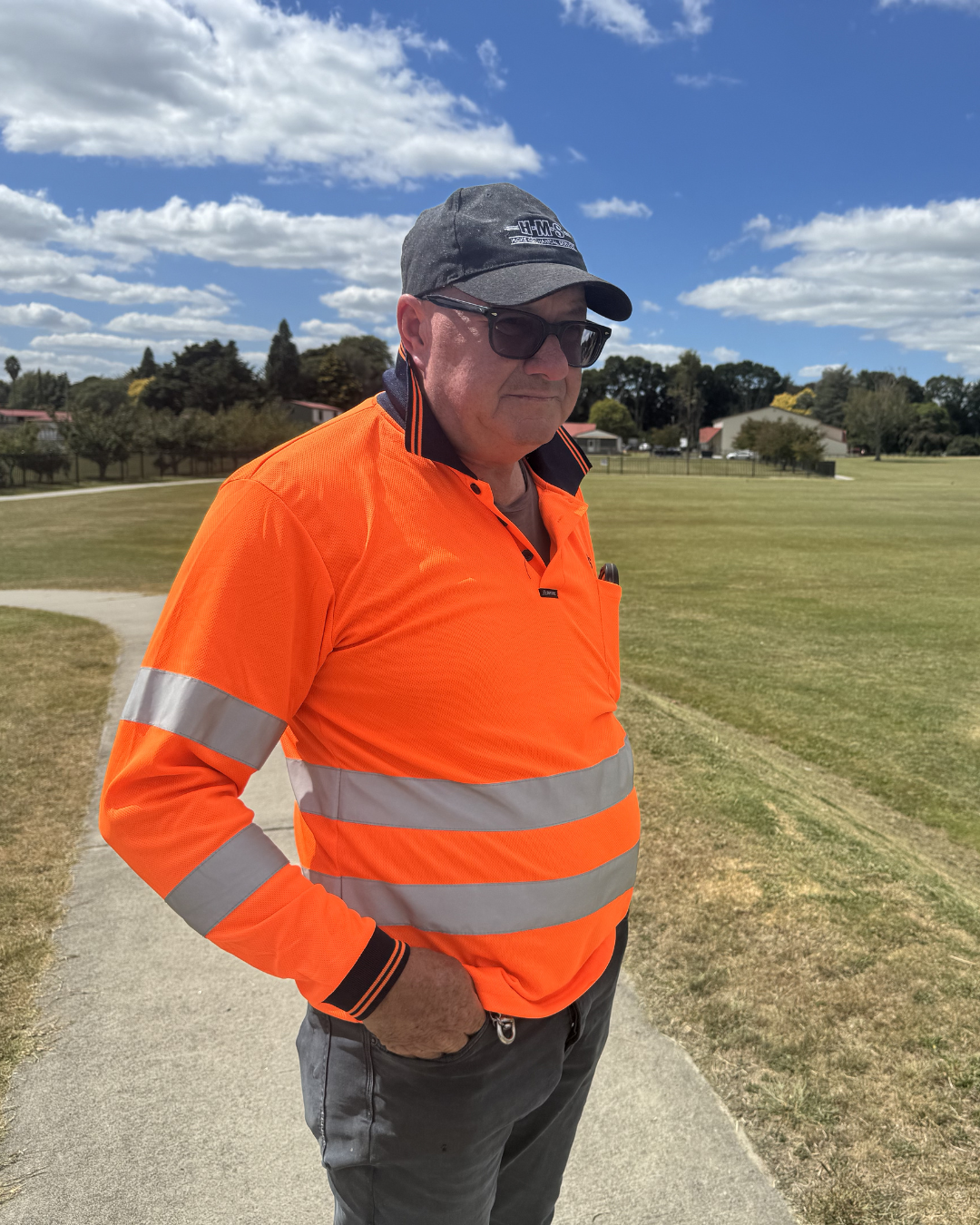 Headshot of smiling female tutor with short blonde hair wearing a lanyard.