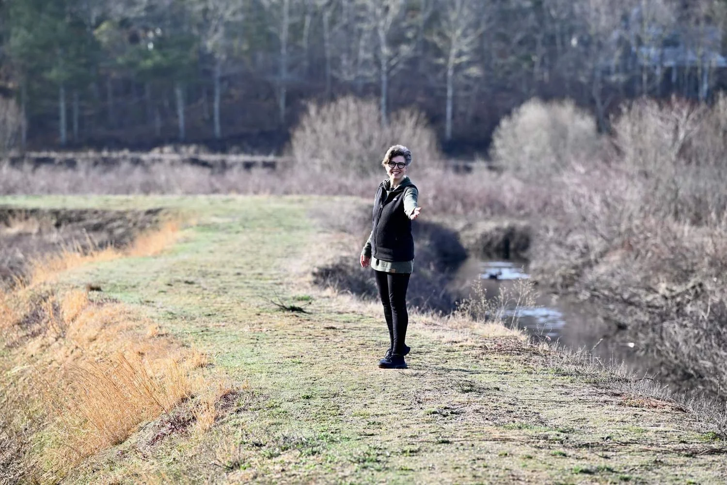 Libby Catania standing in a winter meadow, offering teachings on spiritual direction and healing from religious trauma