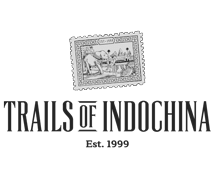 Black and white postage stamp with an illustration of elephants and trees.