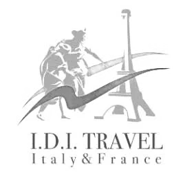 Logo for I.D.I. Travel featuring two travelers with backpacks and a large compass, with the text "I.D.I. TRAVEL Italy & France" underneath.