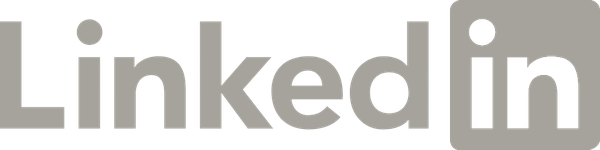 Grey LinkedIn logo on a black background.