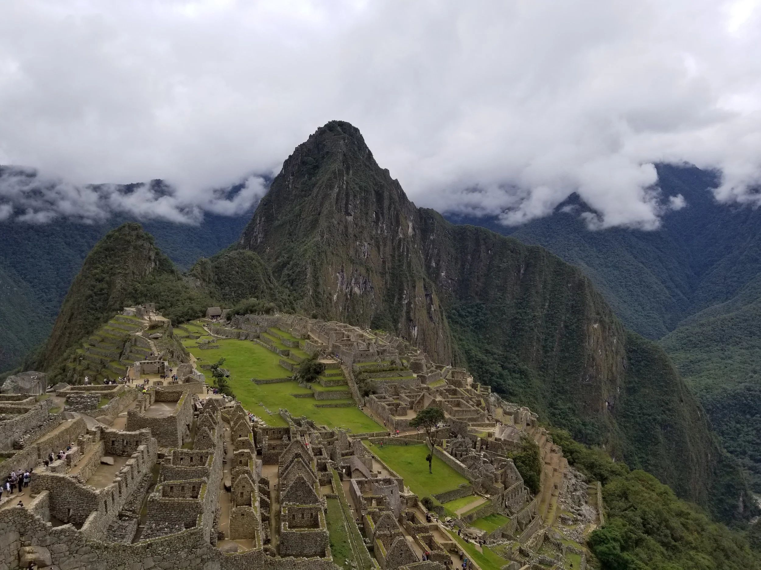 The iconic view of Machu Picchu with Huayna Picchu towering above the ancient Inca city in the Peruvian Andes.