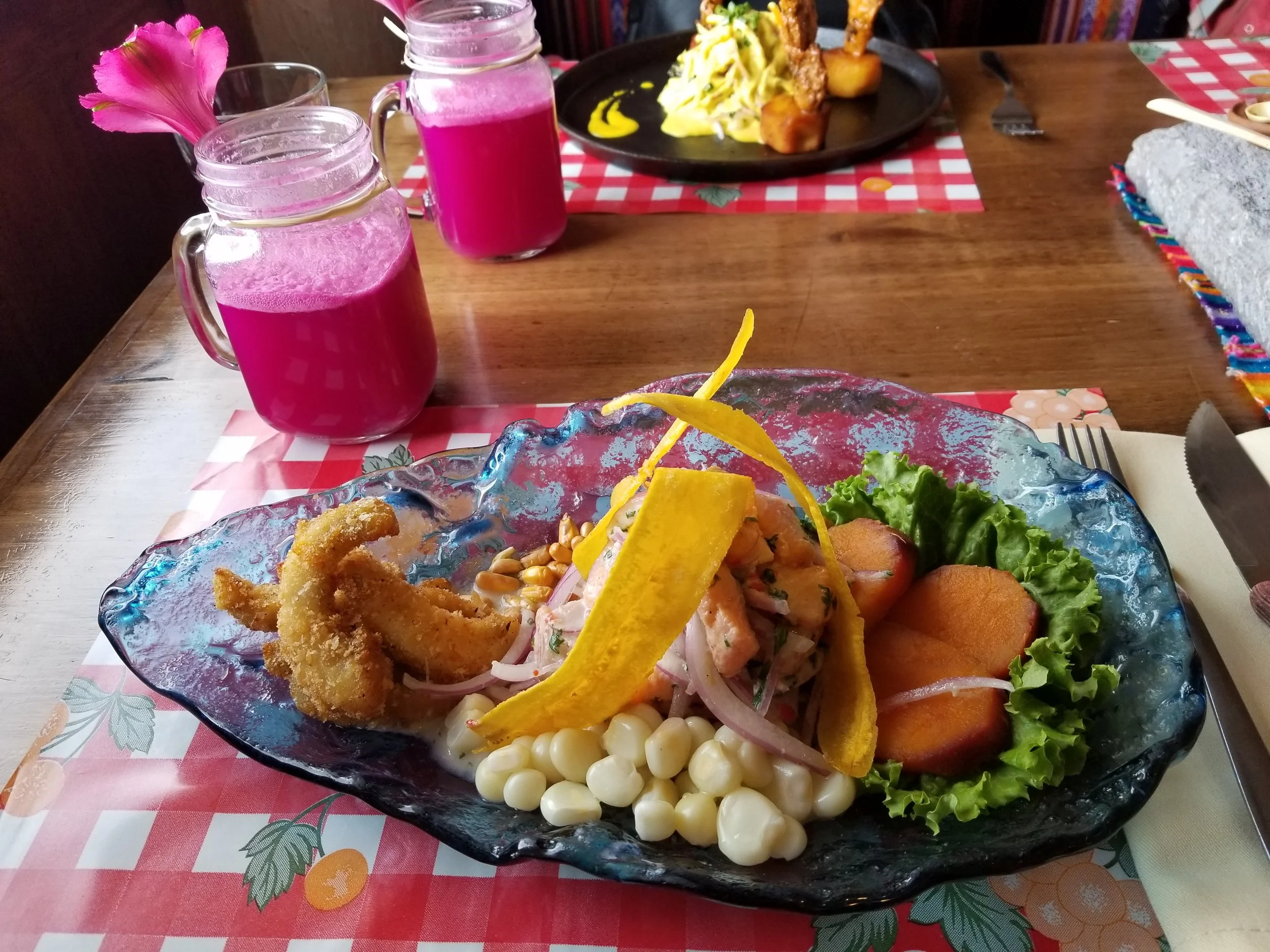 Fresh Peruvian ceviche served with corn and seafood — a vibrant taste of Cusco’s culinary scene.