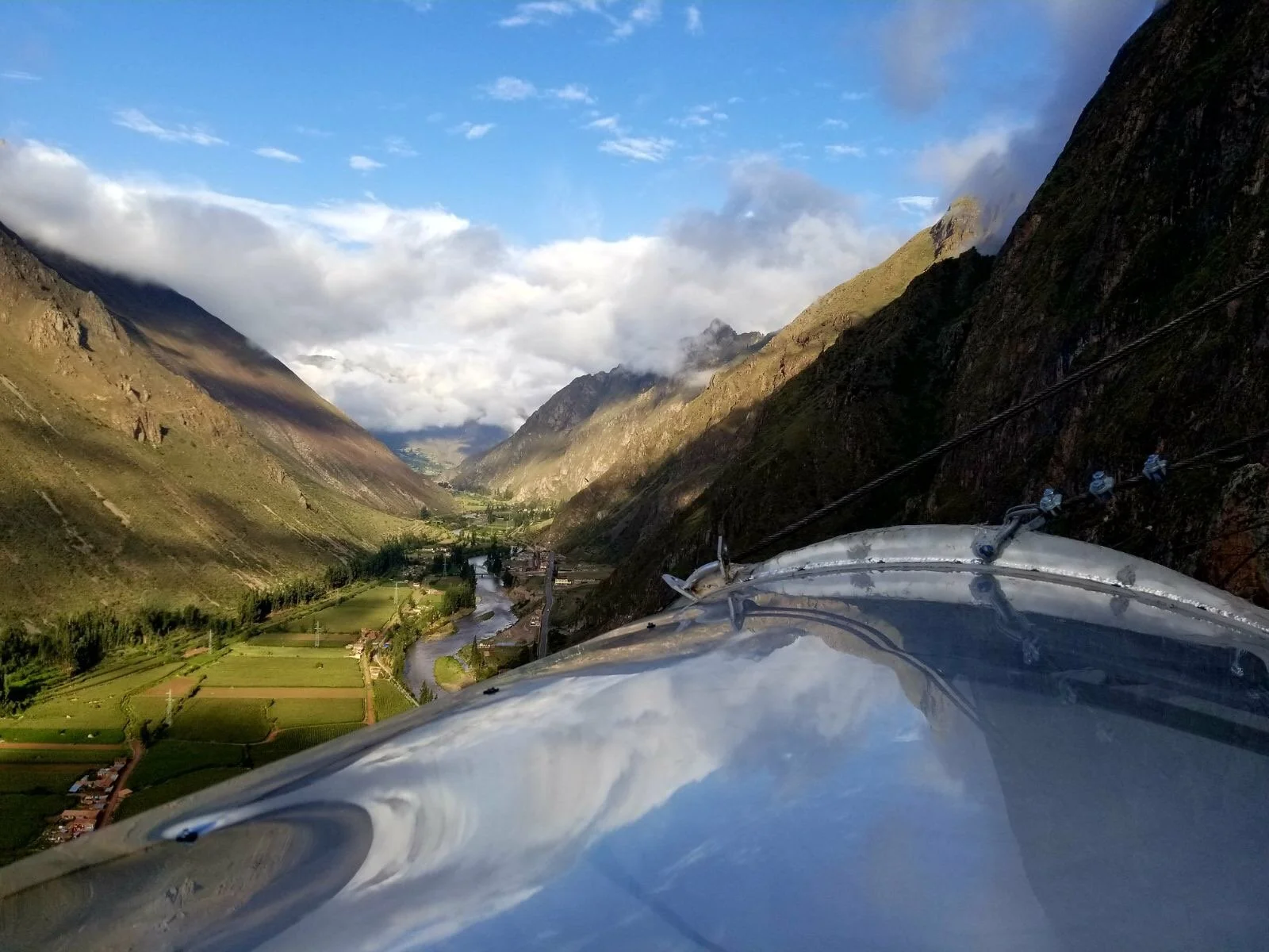 View of Peru’s Sacred Valley and the Urubamba River from the roof of a Skylodge Adventure Suites glass capsule near Cusco.