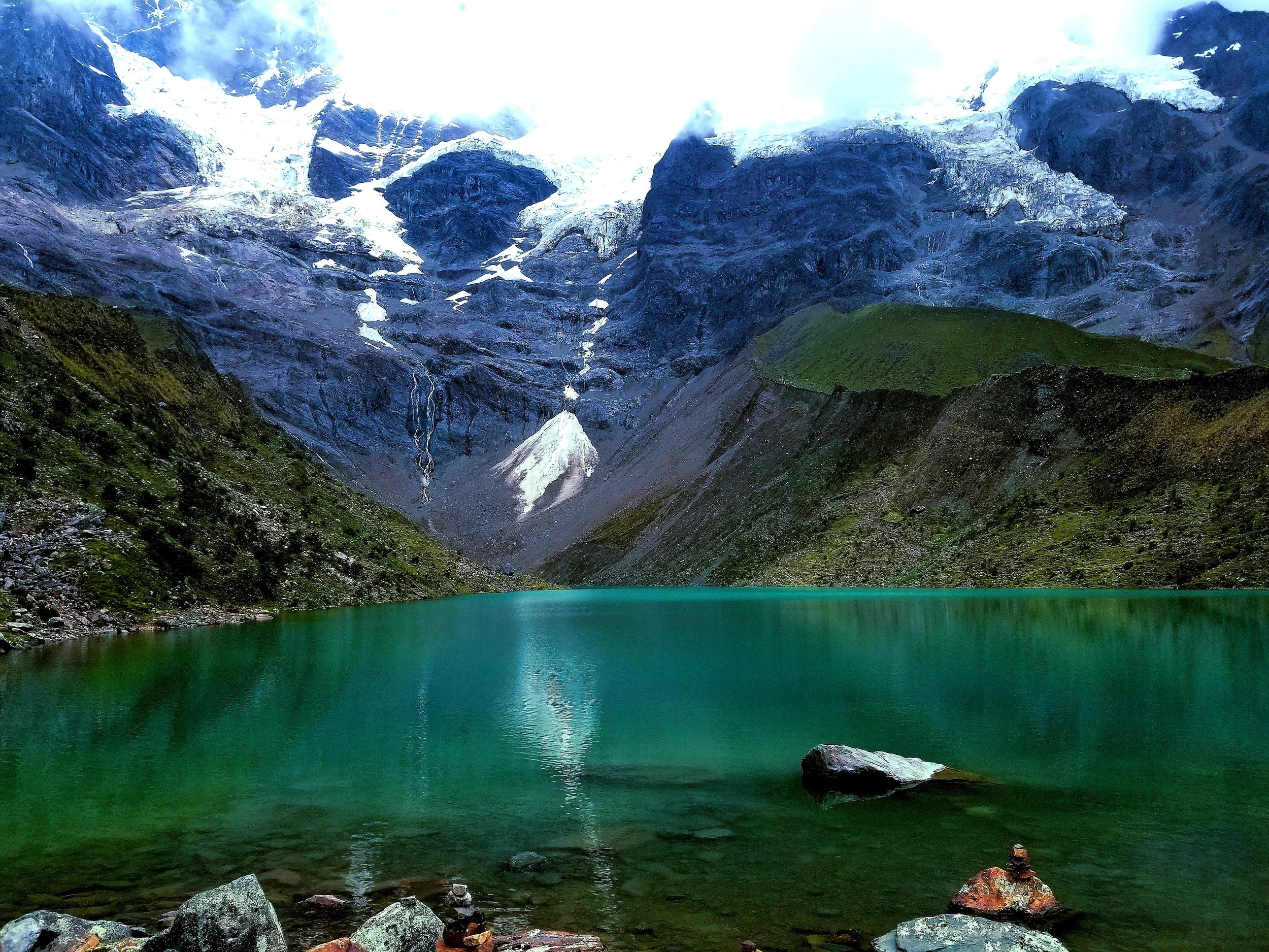 Humantay Lake, a turquoise glacial lake in the Andes Mountains near Cusco on the Salkantay Trek in Peru.