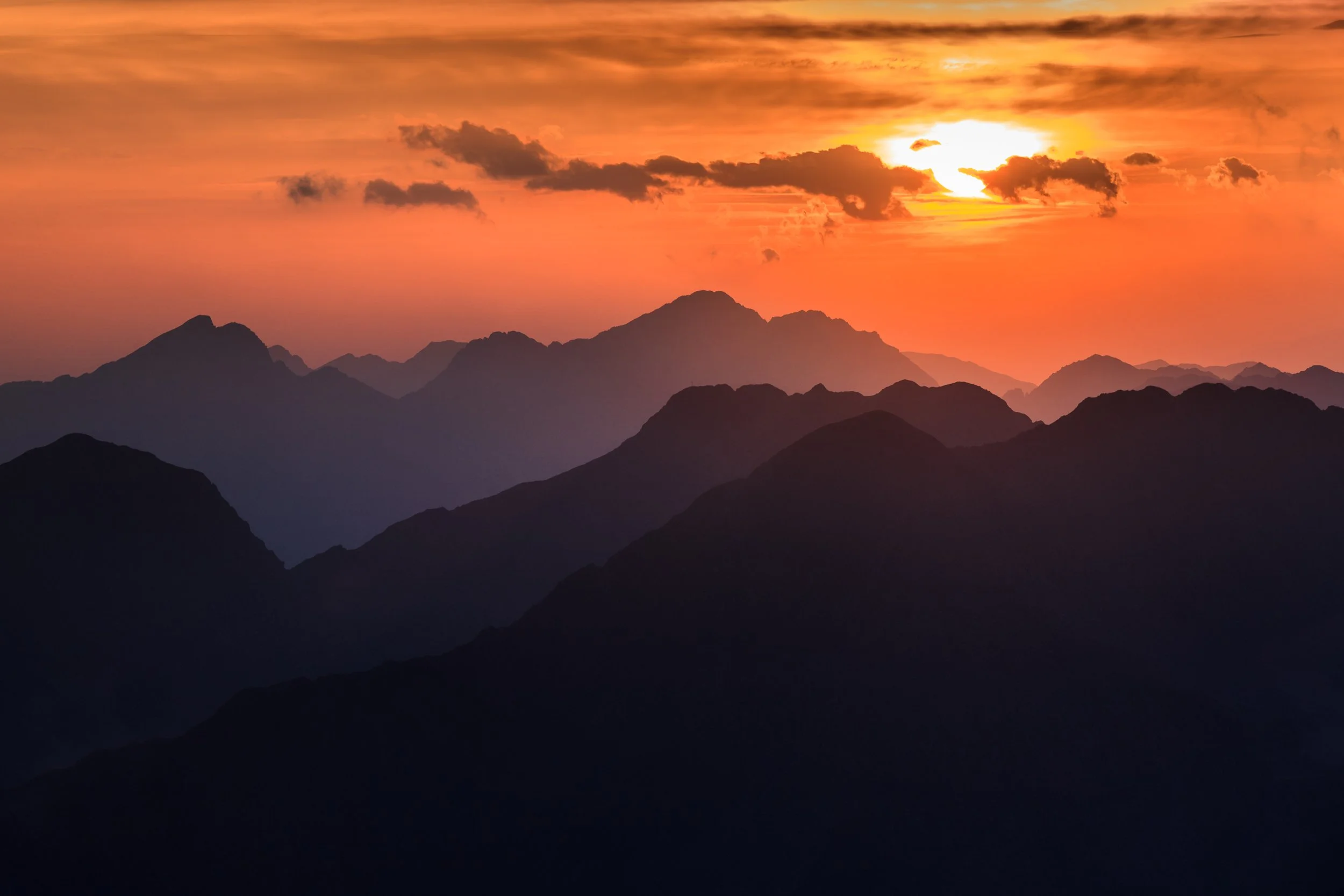 Sunset over Moldoveanu Peak in the Făgăraș Mountains, the highest summit in Romania’s Carpathian range.
