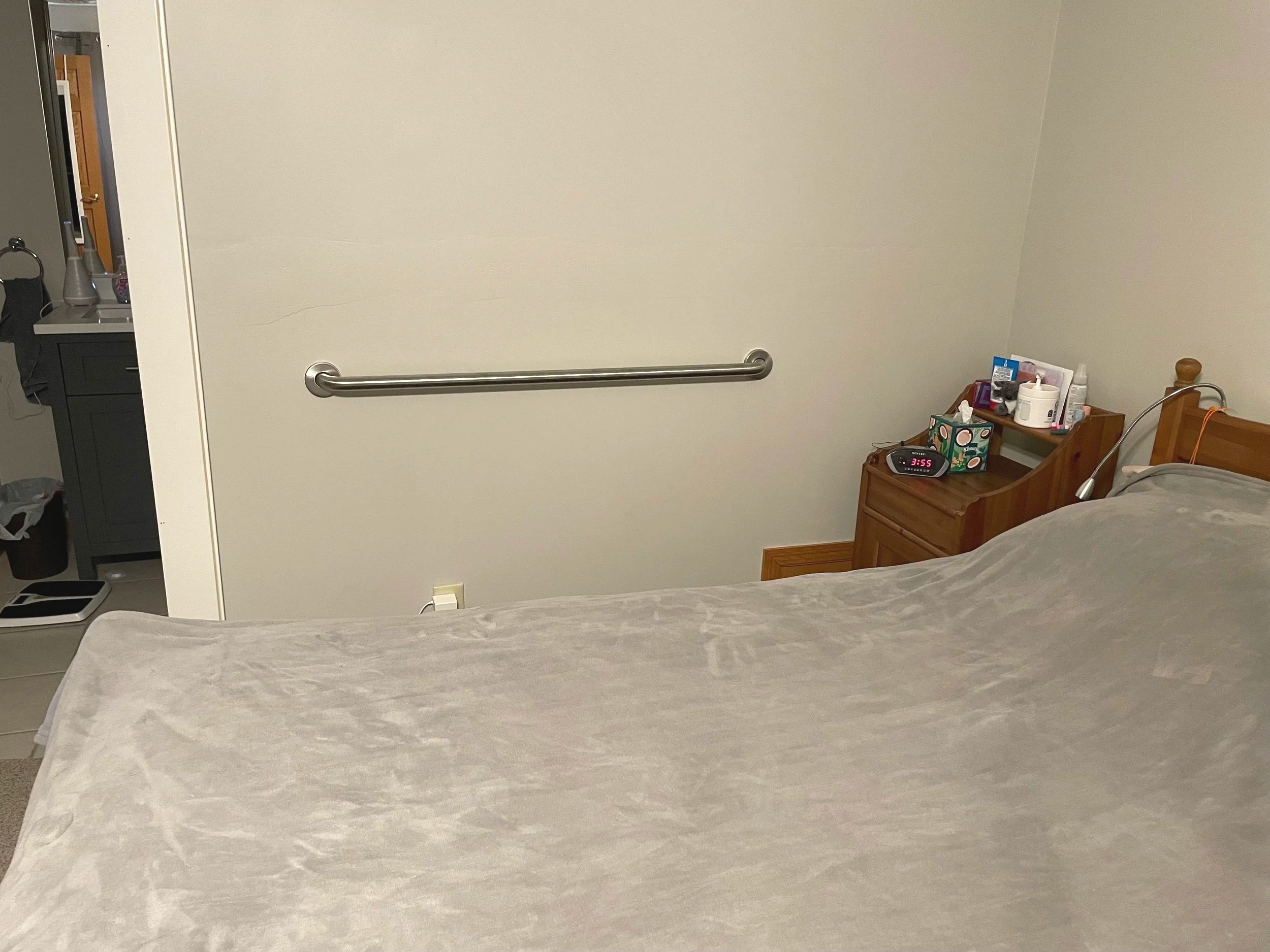Bedside grab bar for safer transitions in and out of bed