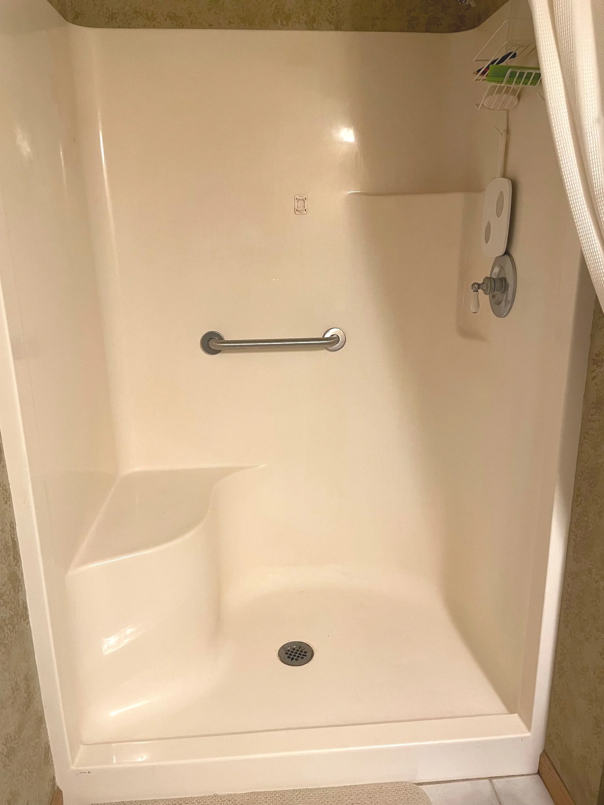 Shower grab bar installation to help prevent slips and falls