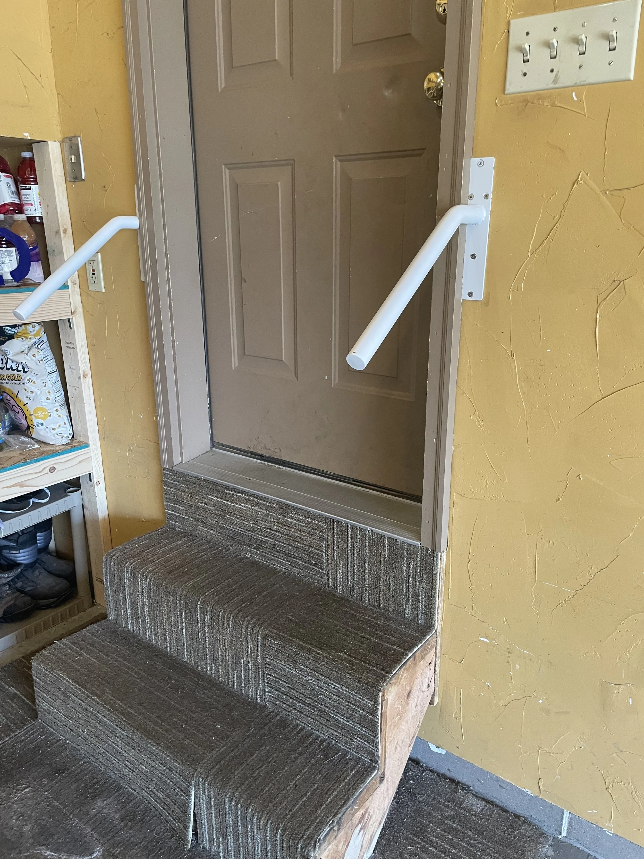 Grab bar installed near entryway for safe home access