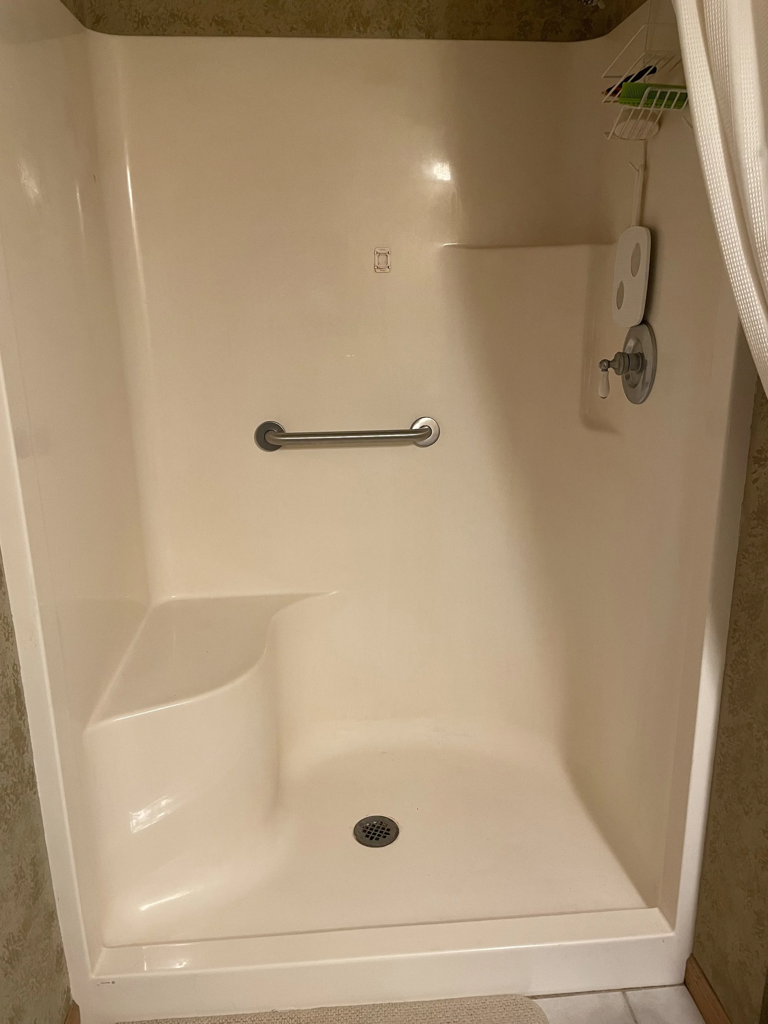 Shower grab bar installation to help prevent slips and falls