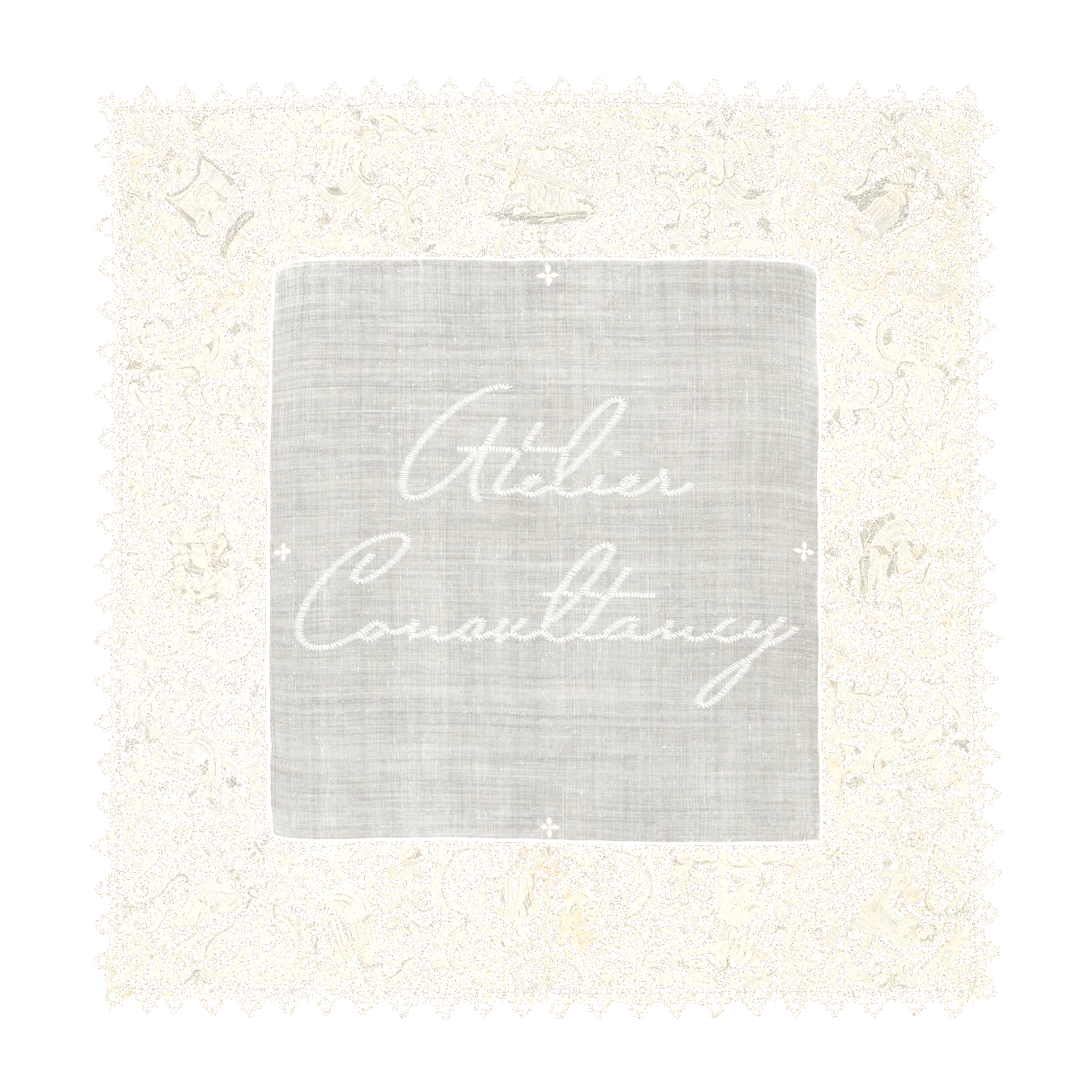 Lace tablecloth with an embroidered central section reading 'Atelier Consultancy' in cursive, surrounded by intricate floral and geometric lace patterns.
