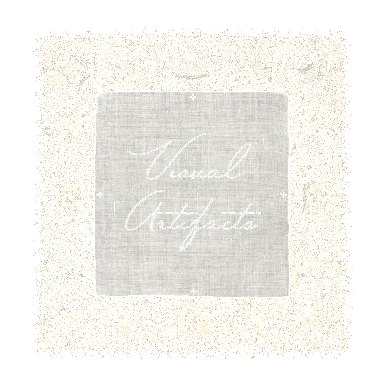 A white embroidered cloth with lace edges and the words 'Visual Artifacts' stitched in the center.