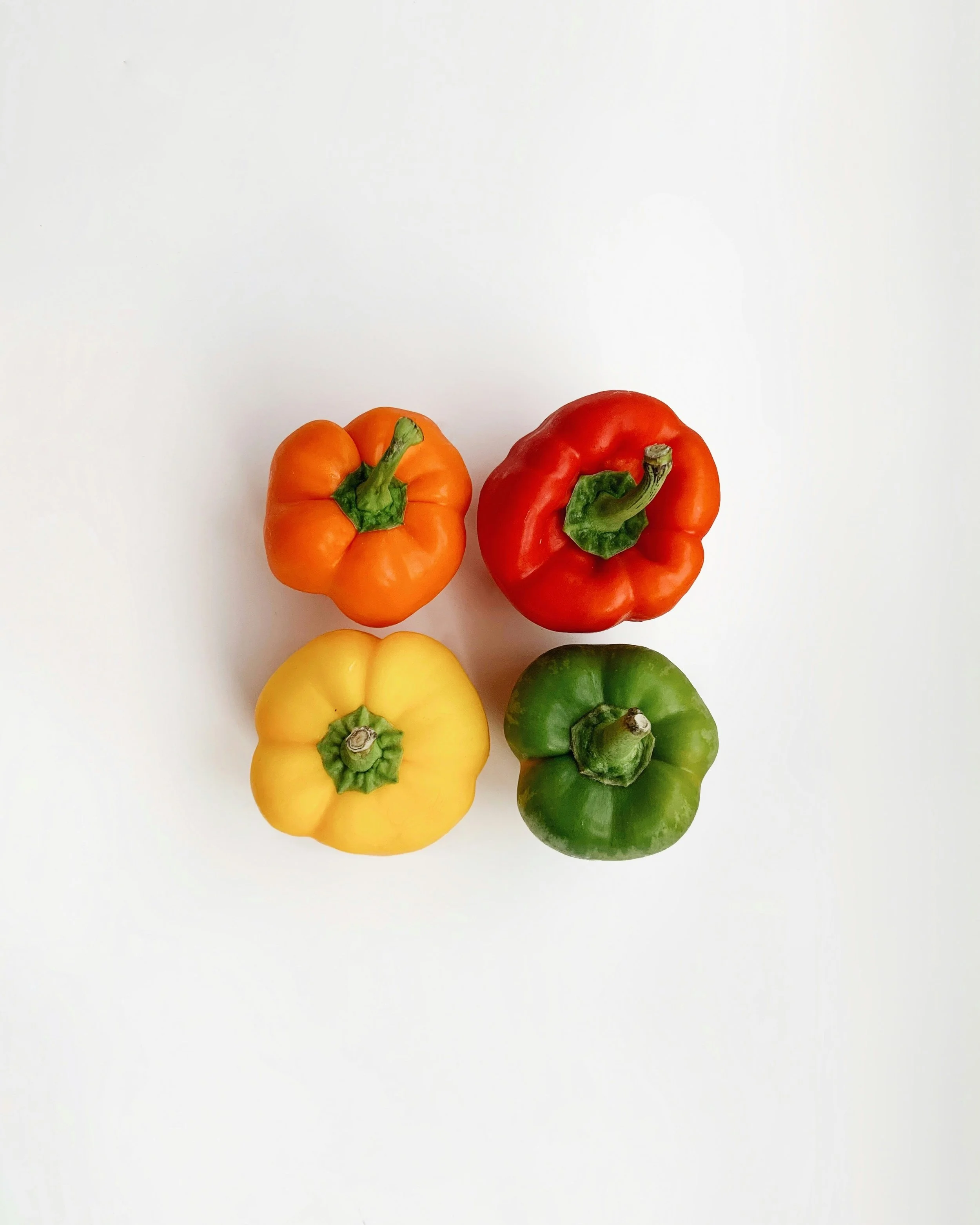 red orange yellow and green bell peppers