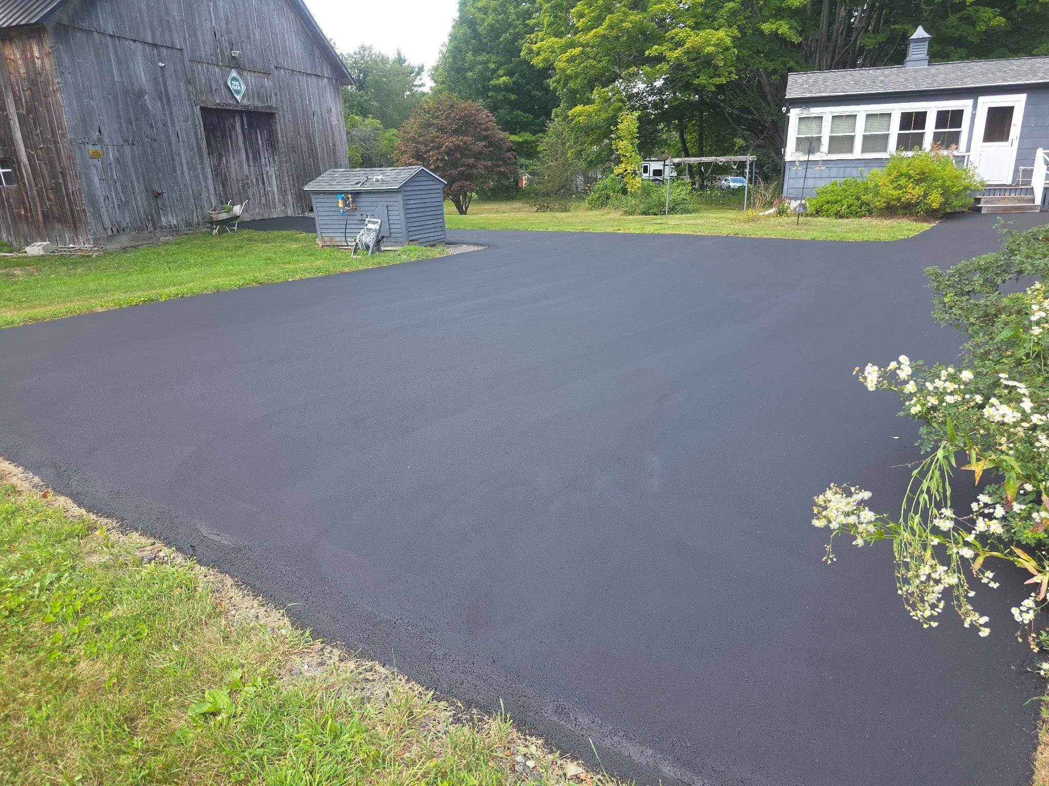 Freshly sealcoated residential driveway in Southern New Hampshire