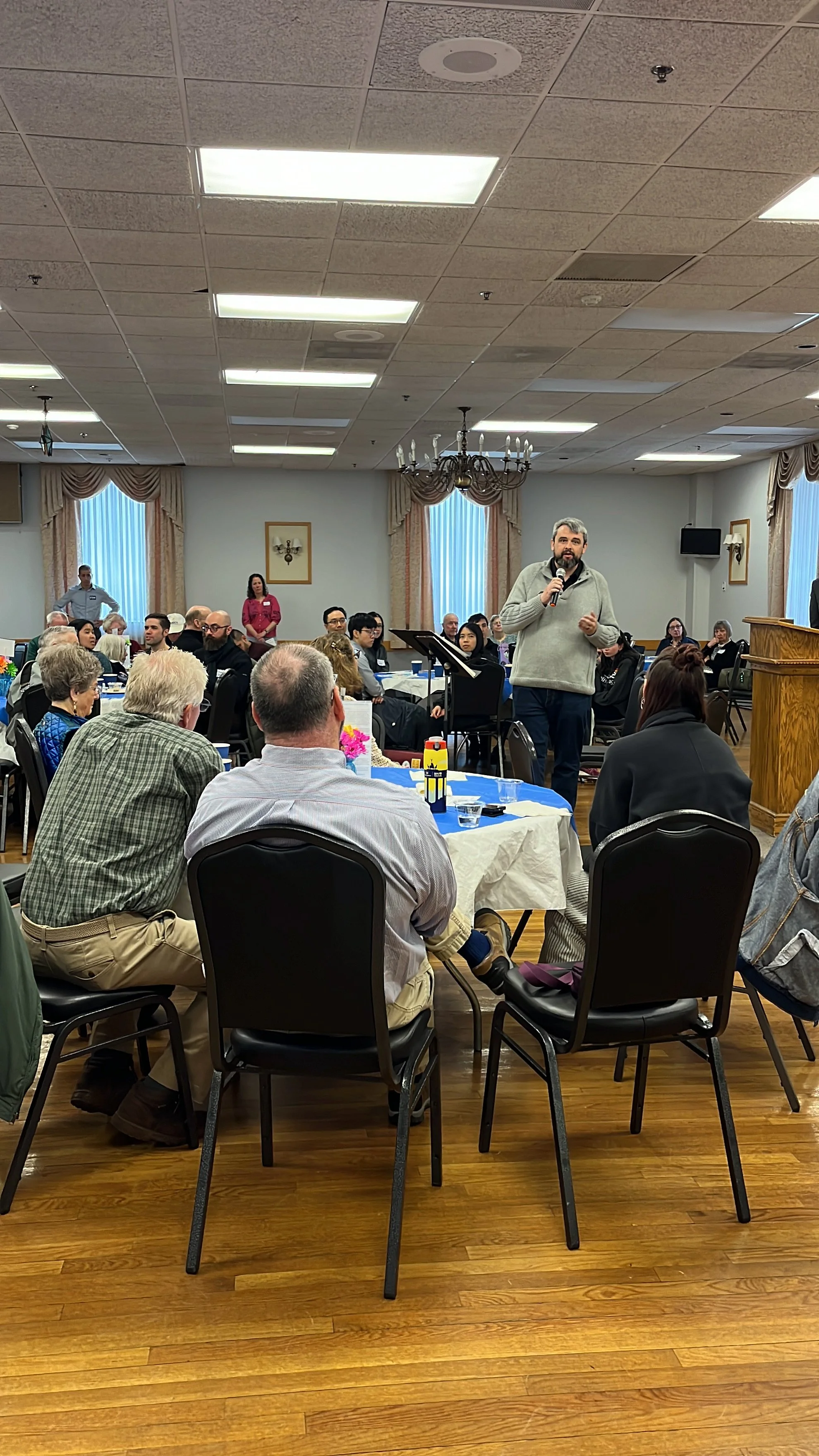 Picture of Jay speaking to a crowd