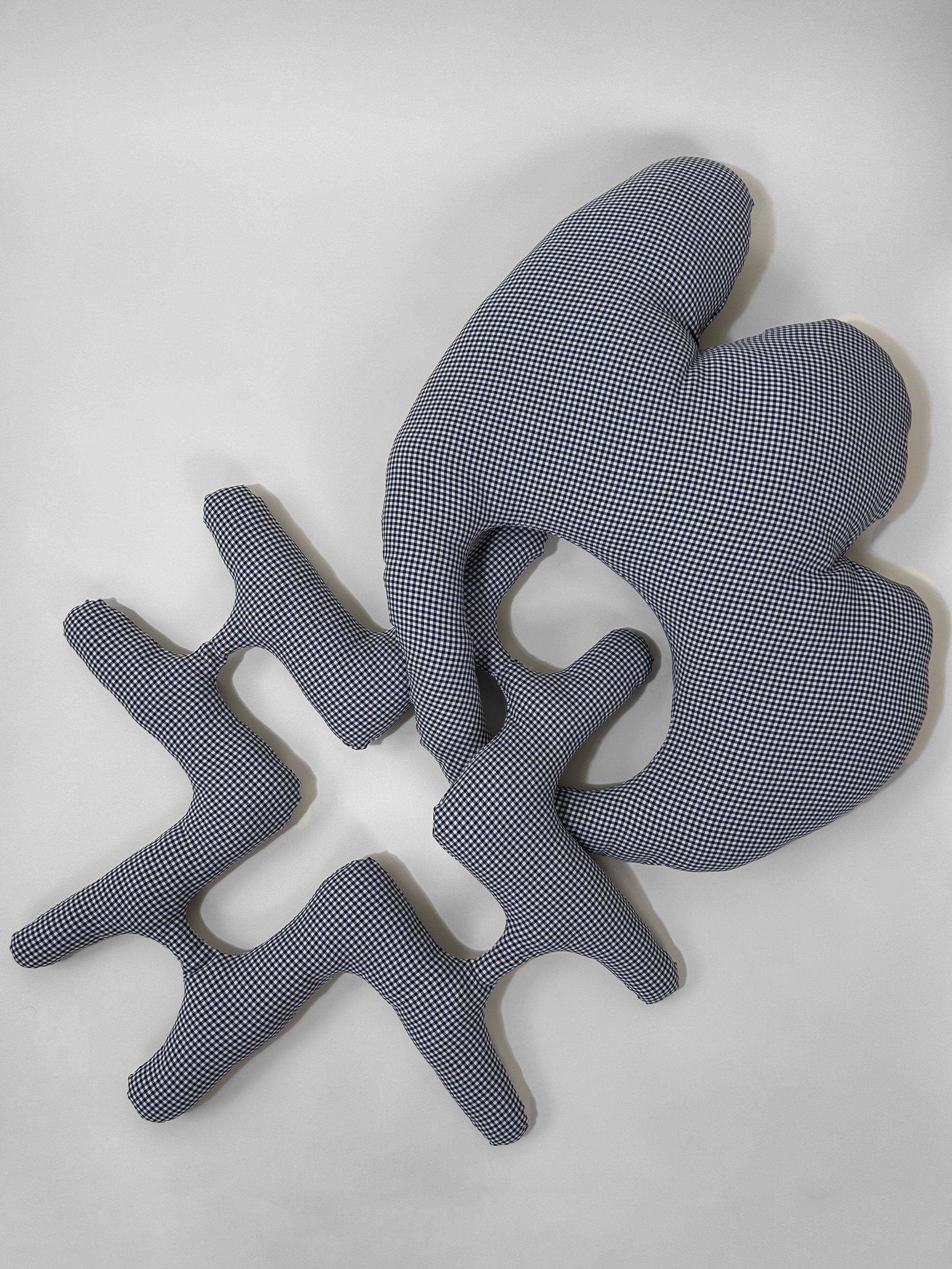 "to stay / to go" polyester and polyfil, 36" x 24" x 3", 2023