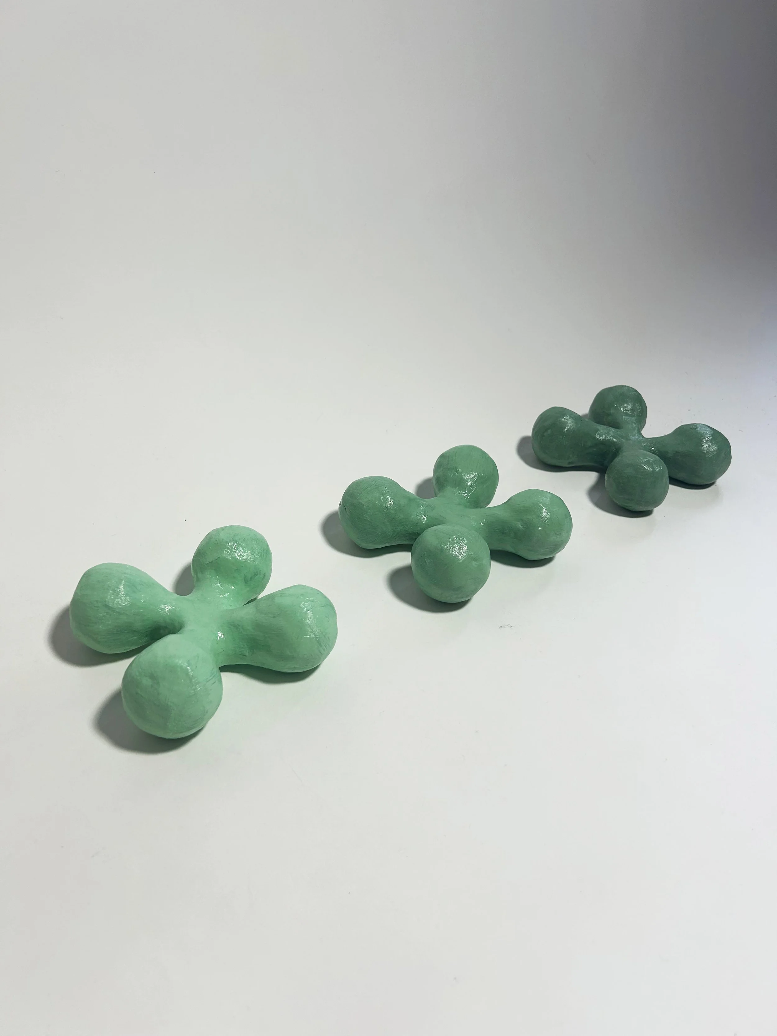 "Clover (1-4)" clay, foam, acrylic paint, gel medium, varying dimensions, 2024