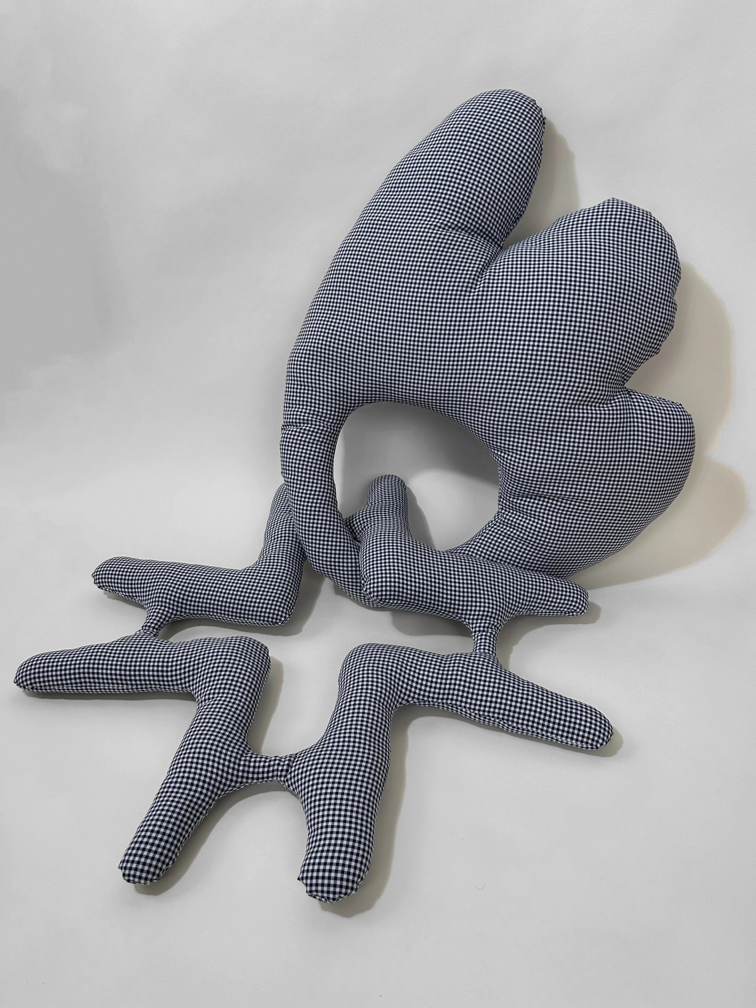 "to stay / to go" polyester and polyfil, 36" x 24" x 3", 2023