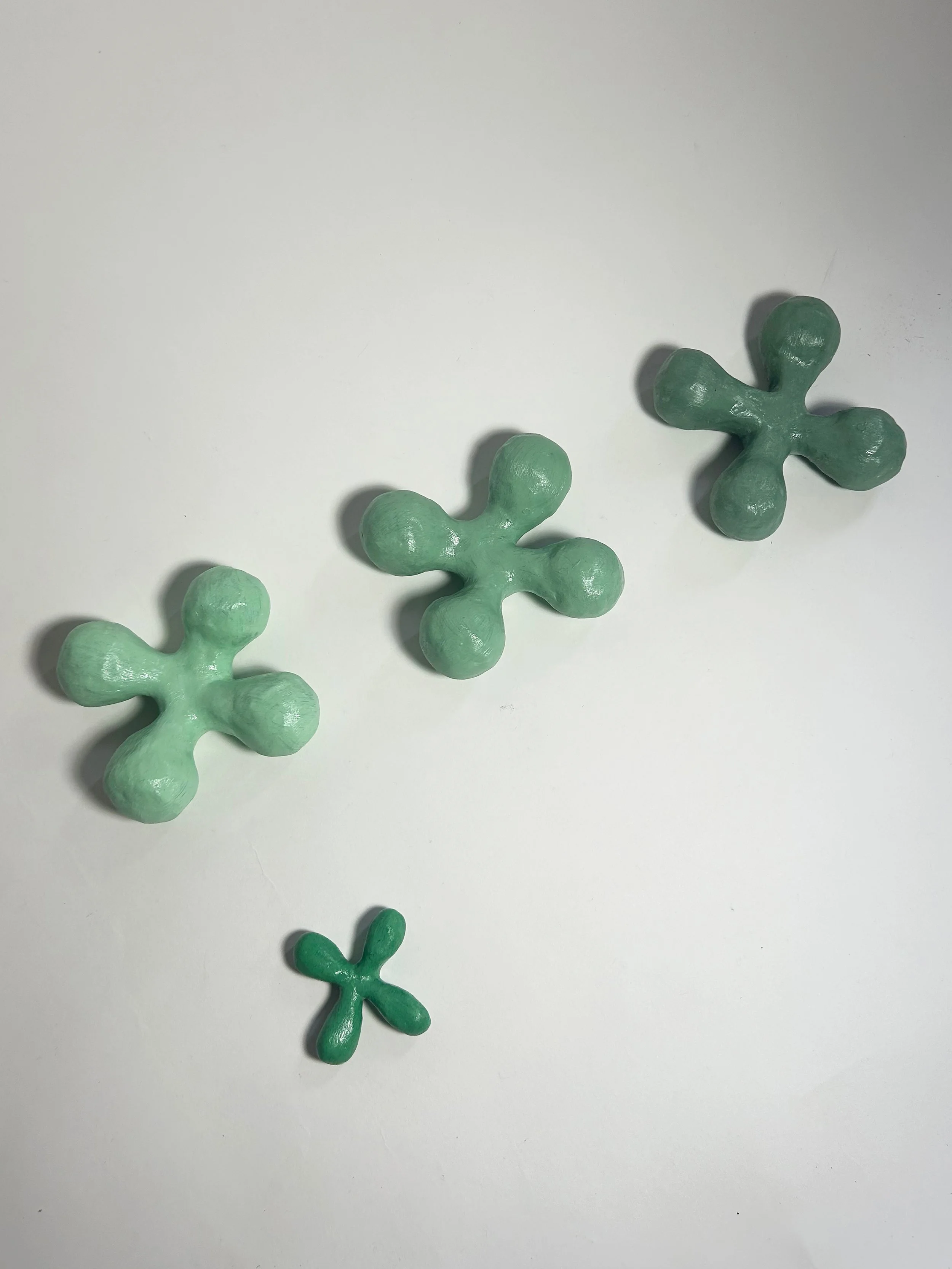"Clover (1-4)" clay, foam, acrylic paint, gel medium, varying dimensions, 2024