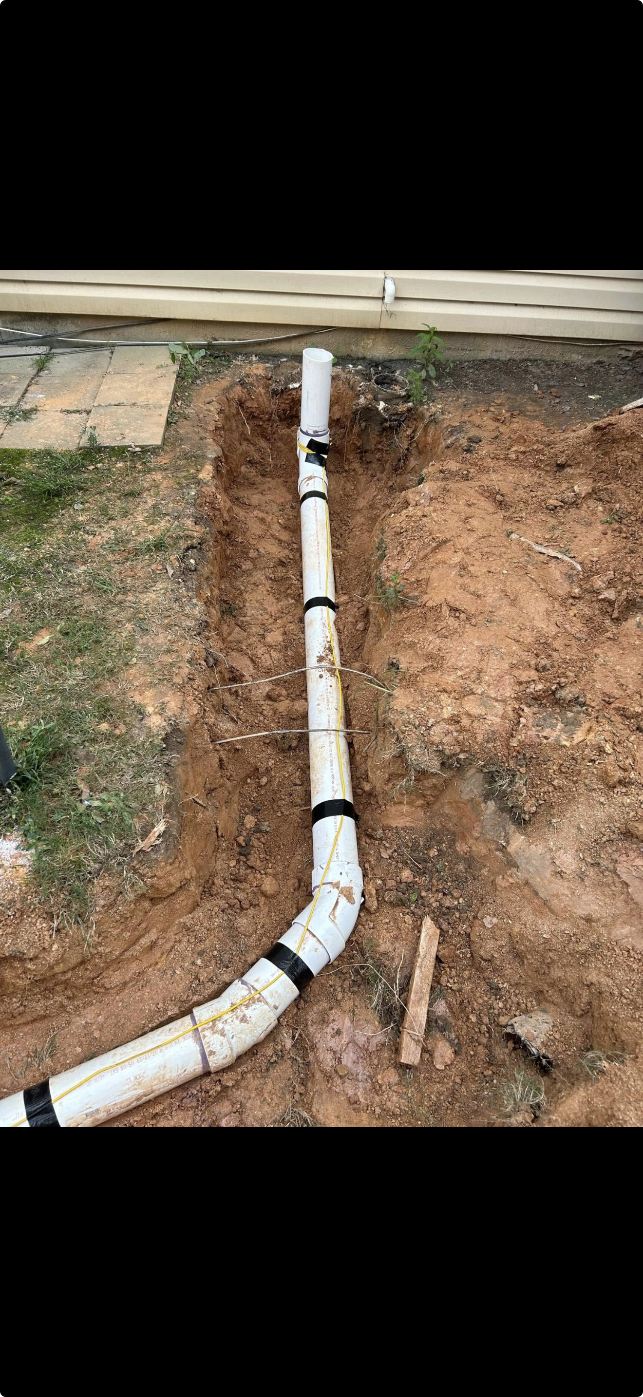 Oranssi technician working on a roof project