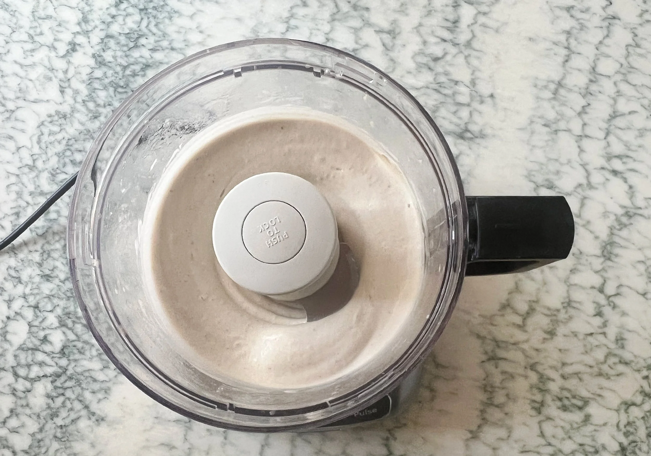 frozen bananas and honey blended smoothly in a food processor, the texture of soft serve ice cream.