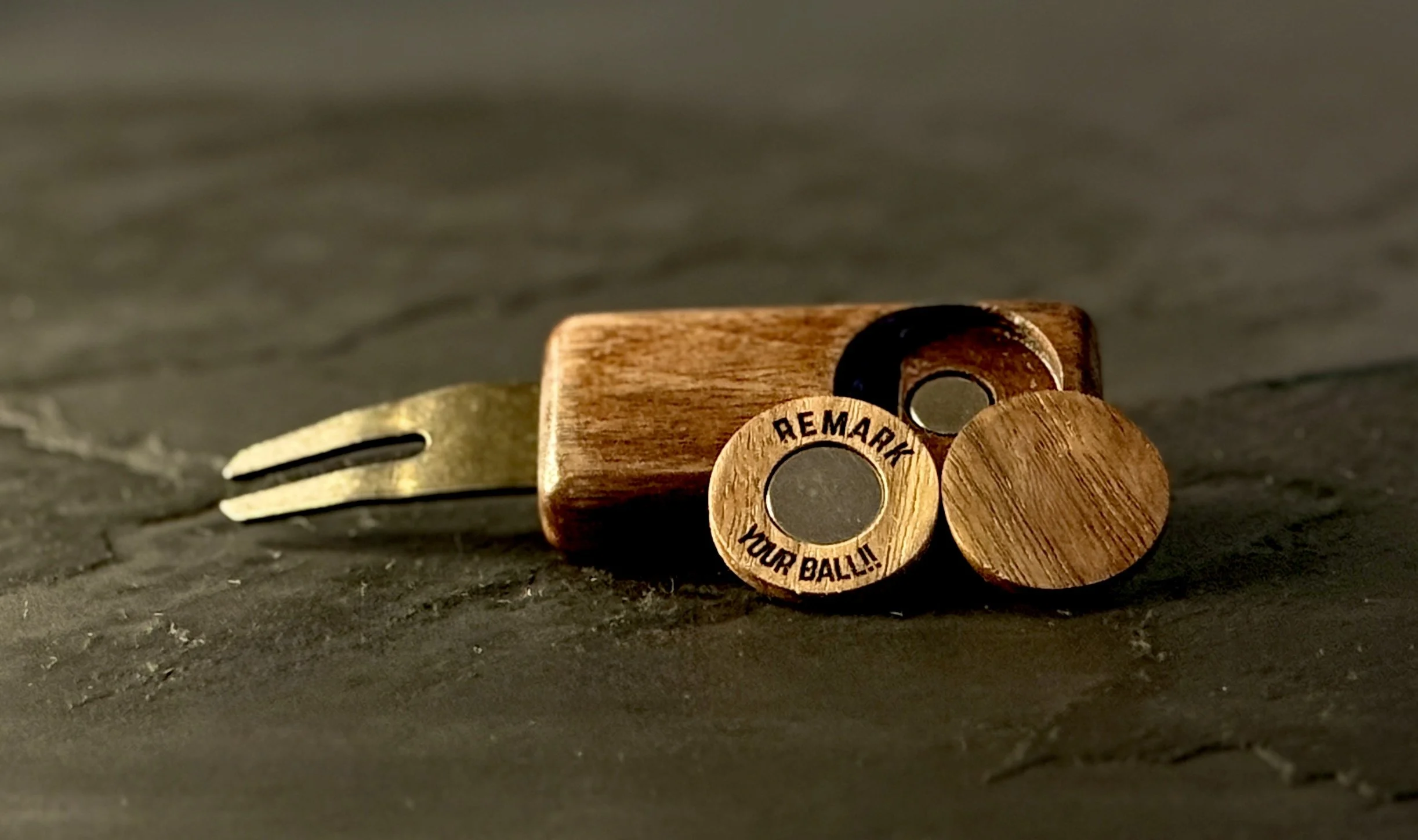 Handcrafted golf divot tool with wooden ball marker removed showing embedded neodymium magnet — The Divsmith