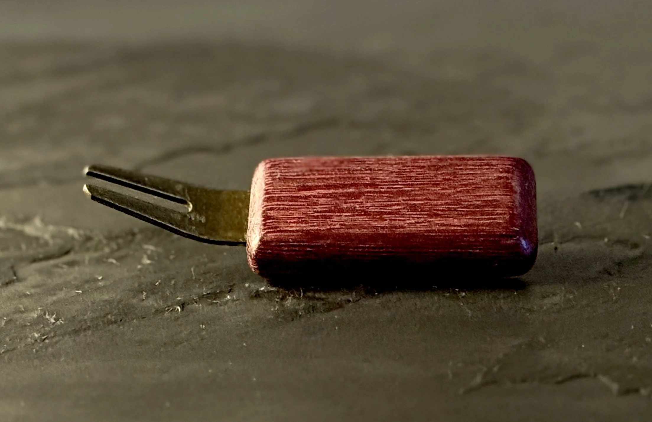 Handcrafted purpleheart wood golf divot tool with antiqued brass hardware