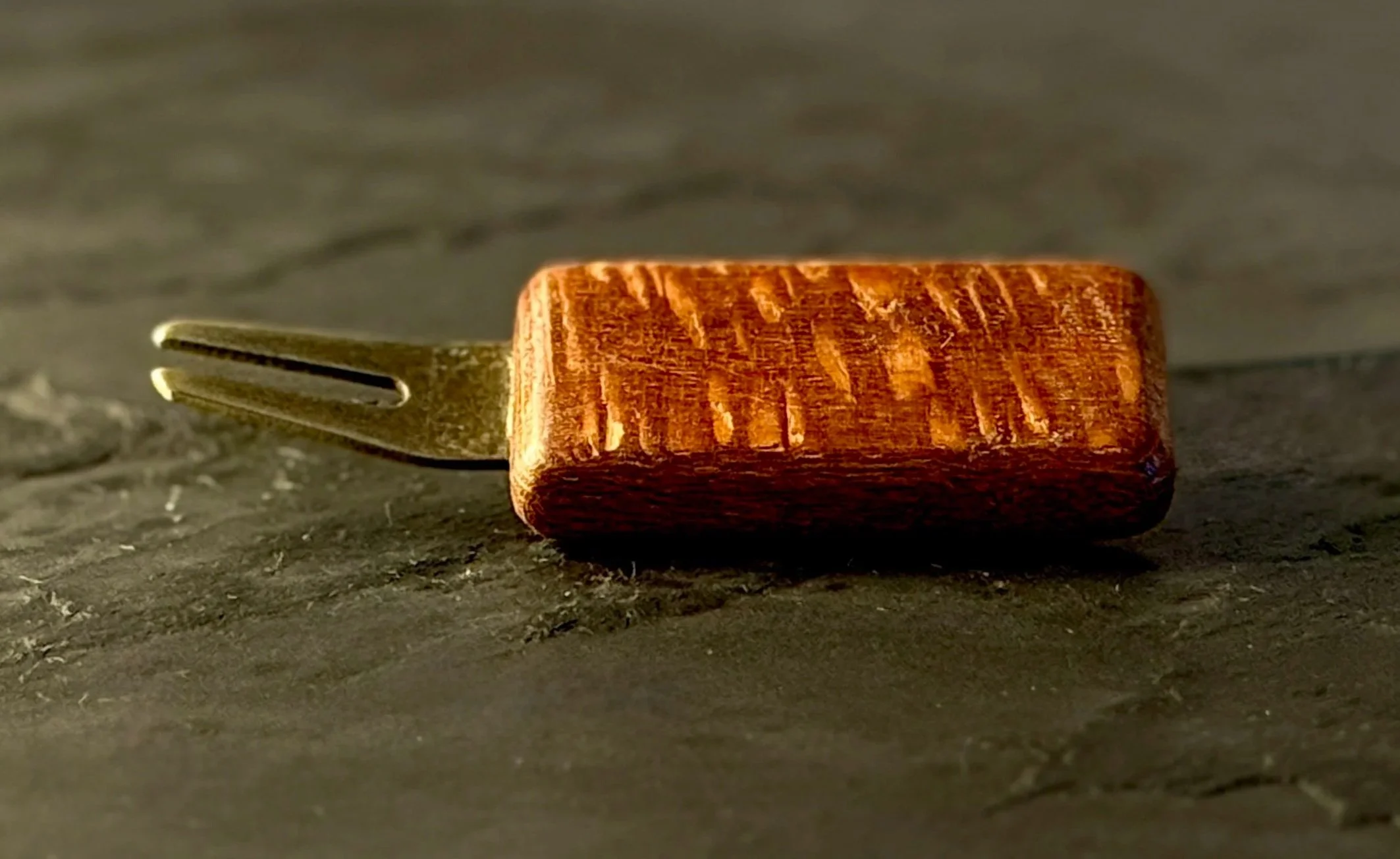 Handcrafted leopardwood golf divot tool with antiqued brass hardware