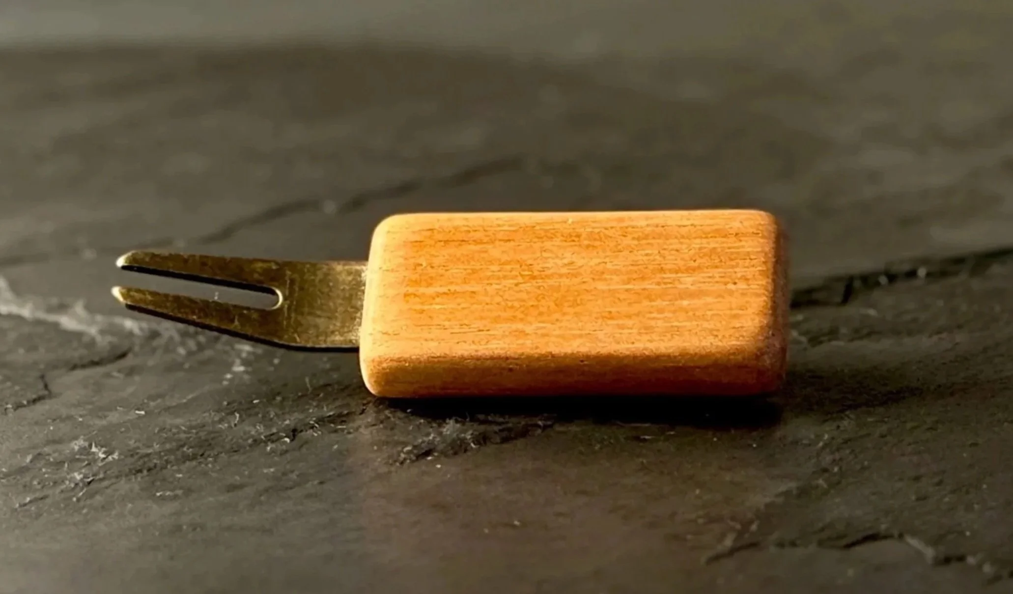 Handcrafted spanish cedar wood golf divot tool with antiqued brass hardware