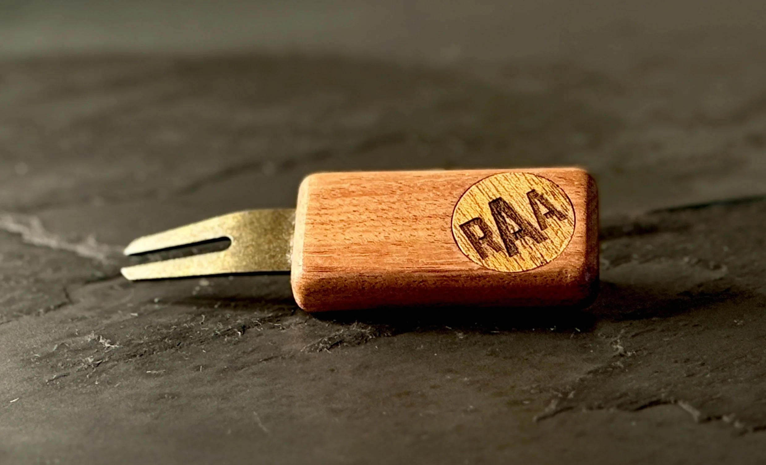 Bubinga golf divot repair tool with personalized wooden ball marker