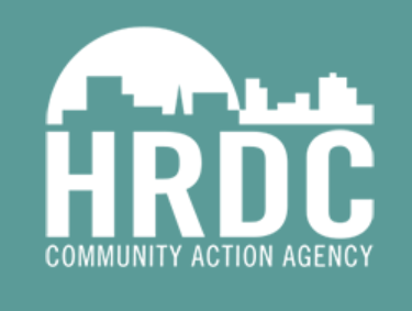 Logo of HRDC Community Action Agency with a city skyline in the background.