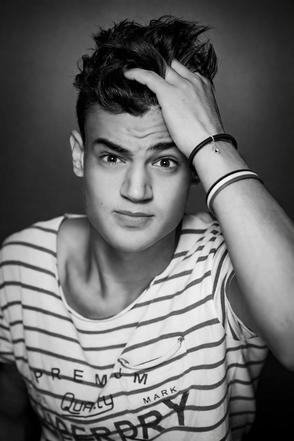 Pensive youth in monochrome portrait.png