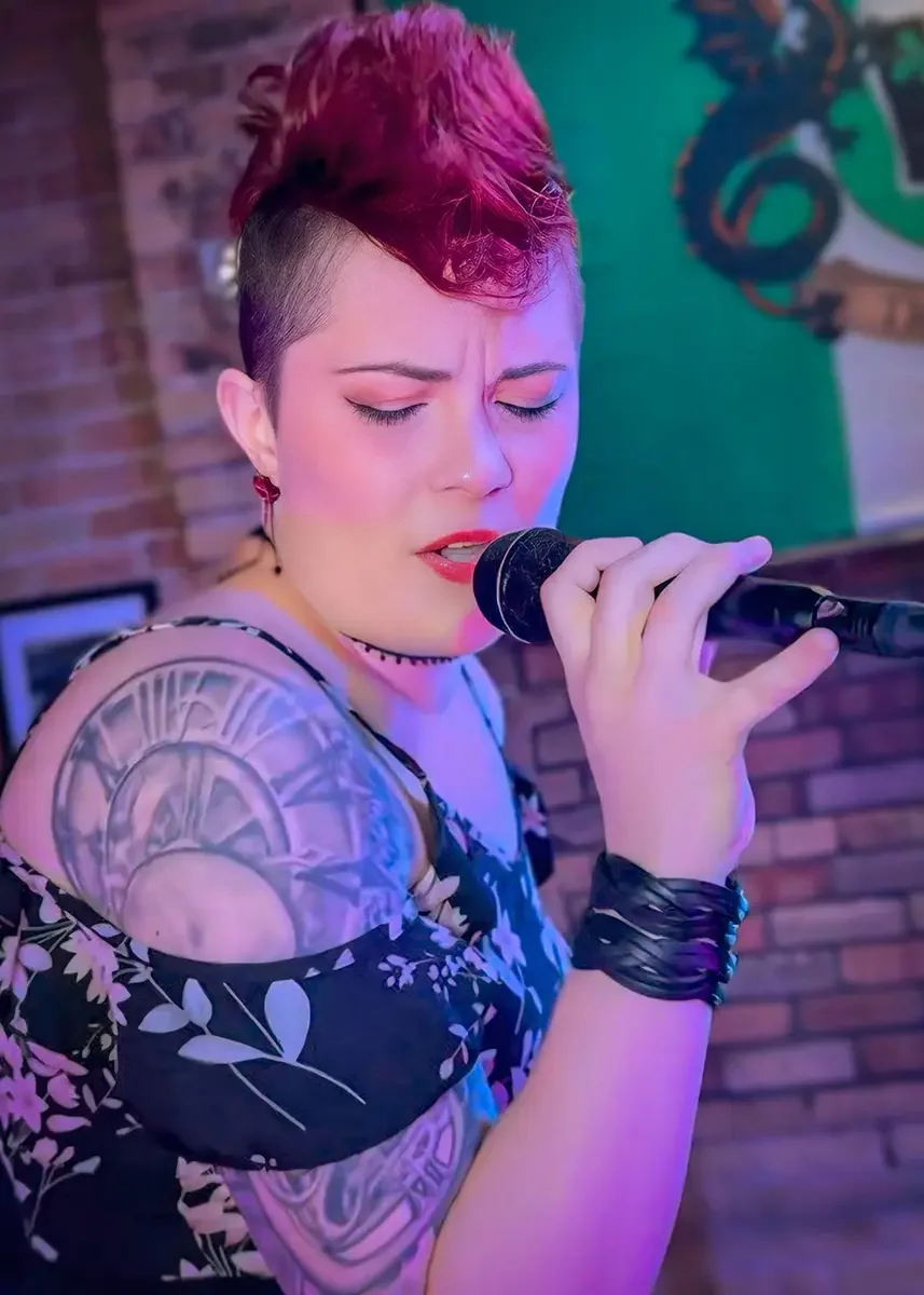 Lady Lulu (Laura Ruesch) hosting karaoke for Thee Bad Romantics, Portland's go to pop-up karaoke team.
