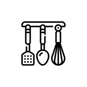 Line of three kitchen utensils hanging on a rack: a spatula, a spoon, and a whisk.