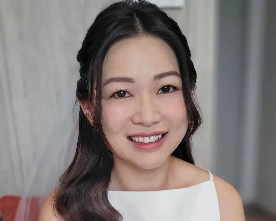 Modern bridal makeup with romantic soft curls.