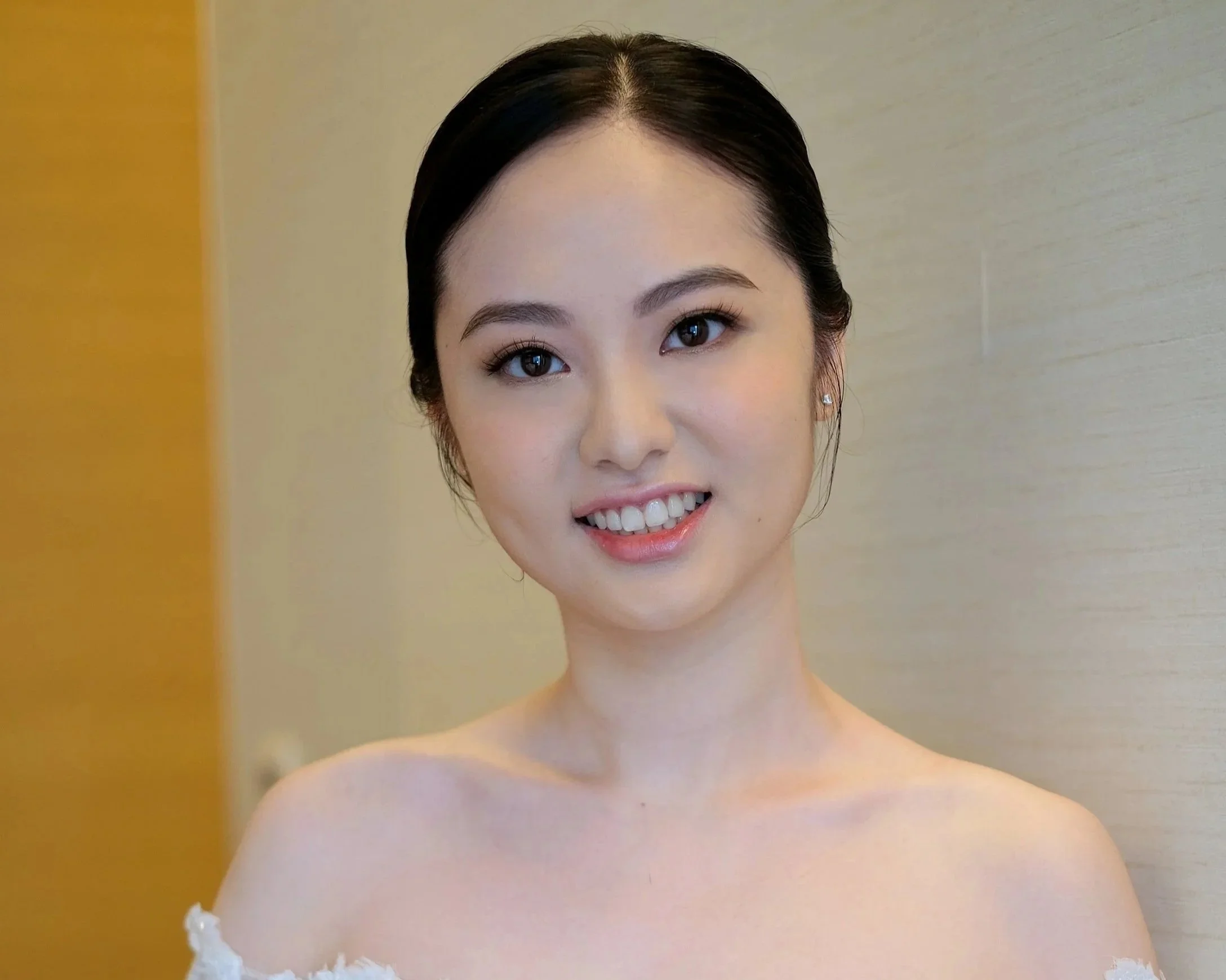 Elegant bridal portrait featuring luxury makeup and hairstyling.