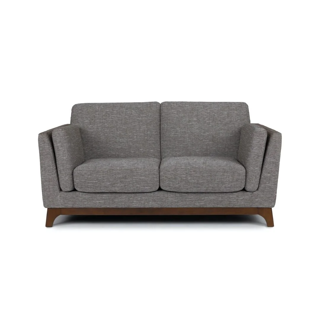 Gray fabric sofa with wooden legs on a white background