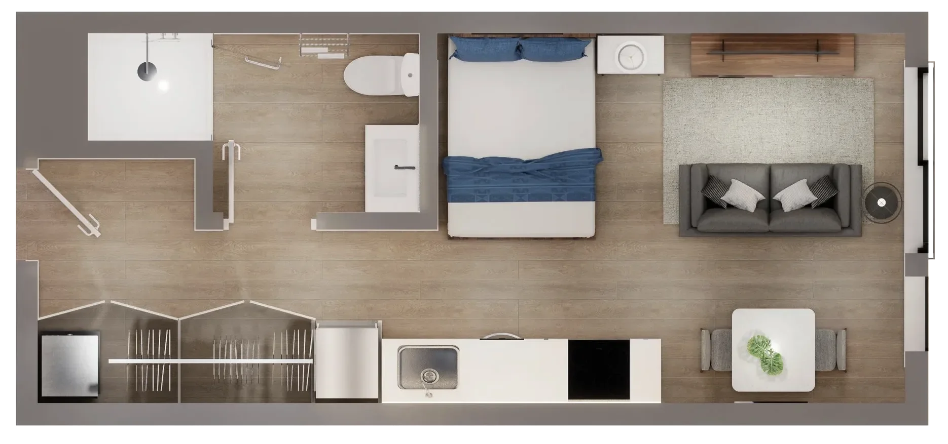 Top-down view of a compact apartment layout featuring a living room with a gray sofa, a small dining table with two chairs, an open kitchen with a sink and stove, a bedroom with a bed and nightstand, and a bathroom with a shower, toilet, and sink.