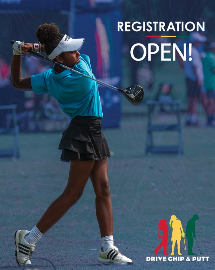 Young girl practicing golf swing at an indoor golf facility with a sign that says 'Registration Open' and a logo for 'Drive Chip & Putt' featuring three colored figures of a golfer, a girl, and a boy.