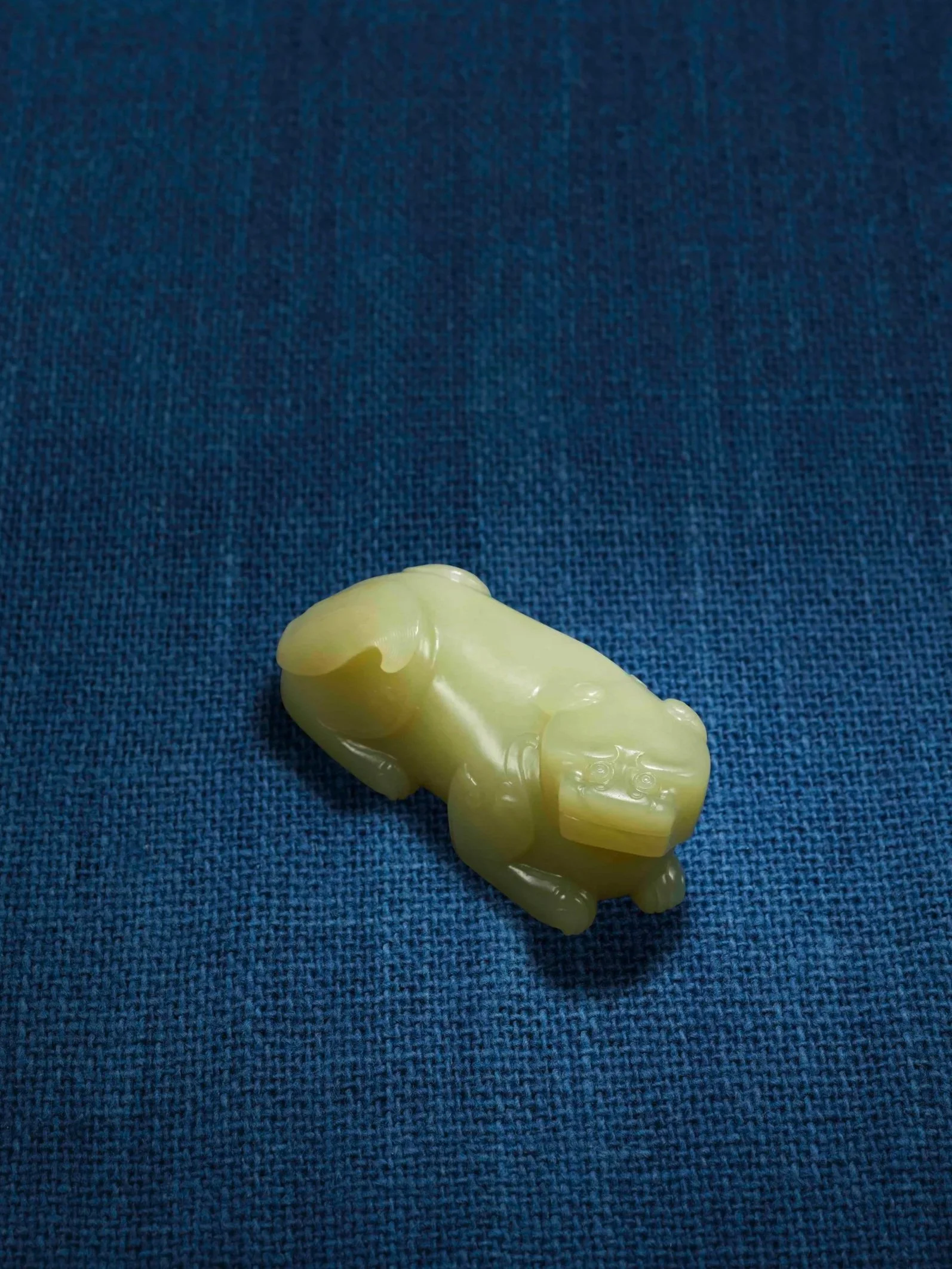 A yellow jade model of a recumbent tiger, China, Ming dynasty, early 17th century