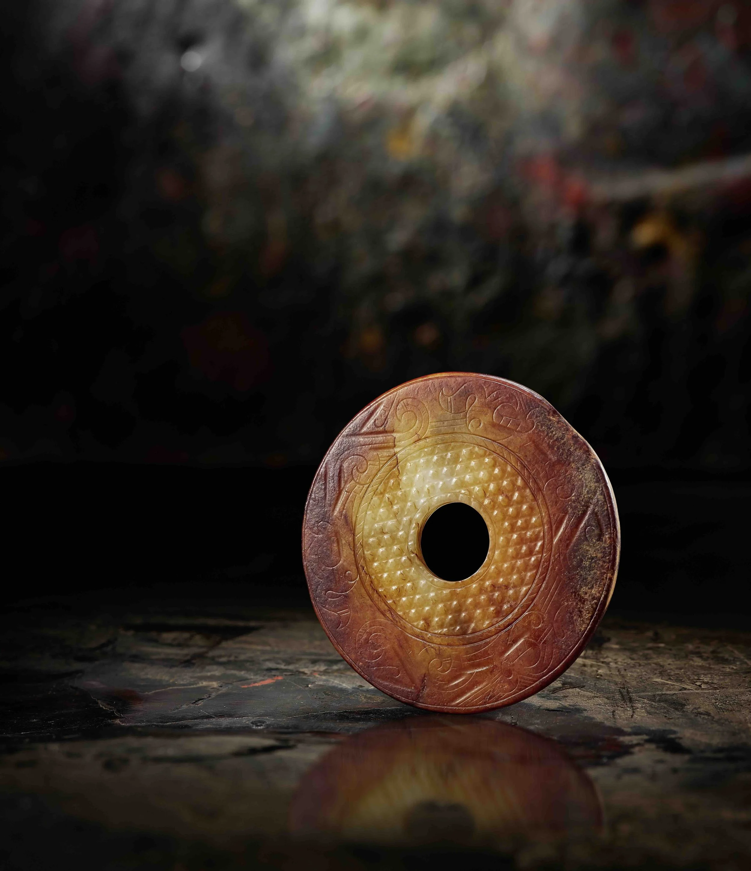 A mottled yellow, white and deep russet jade bi-disc, 
China: Western Han dynasty (206 BCE–8)