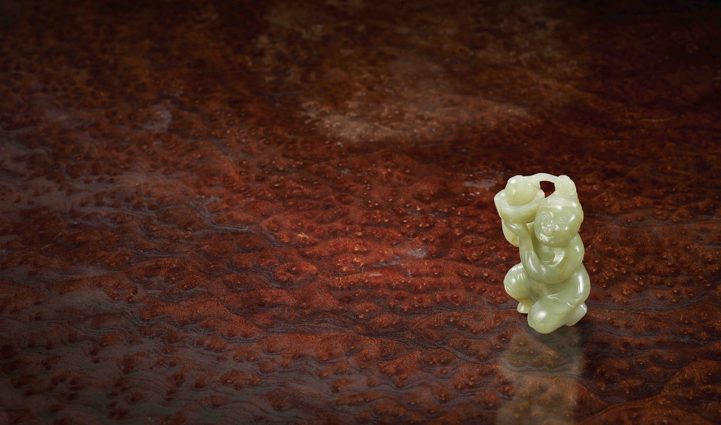 A celadon jade model of a tribute bearer, 
China: Tang dynasty (618–907)