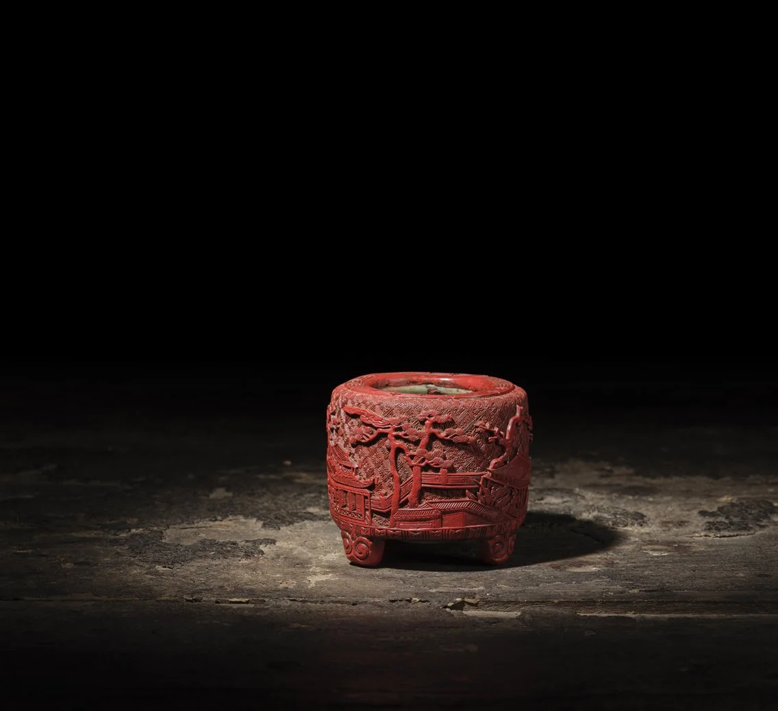 A cinnabar lacquered Longquan celadon tripod incense burner, 
China: the Longquan celadon, late 14th century; the cinnabar lacquer, Hongzhi (1488–1505) to Zhengde
(1506–21) period