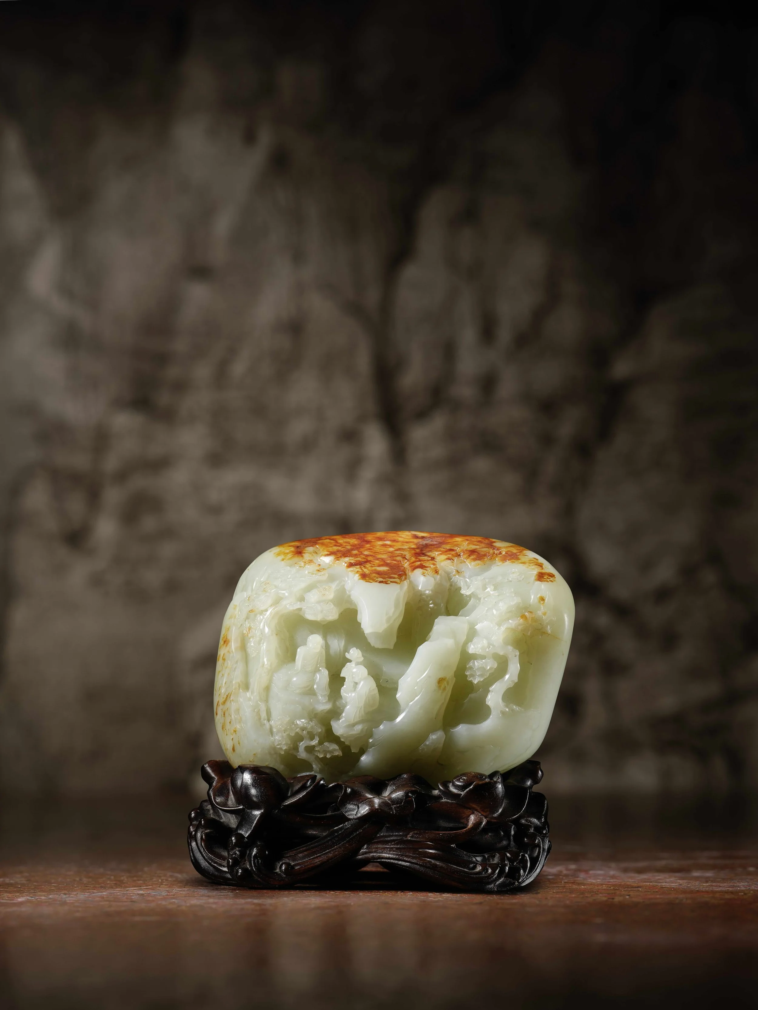 A russet-skinned white jade boulder, 
China, Qianlong period (1736–95)